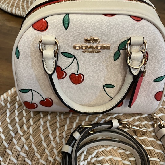 Coach Handbags - Coach Cherry Print Mini Bag in White